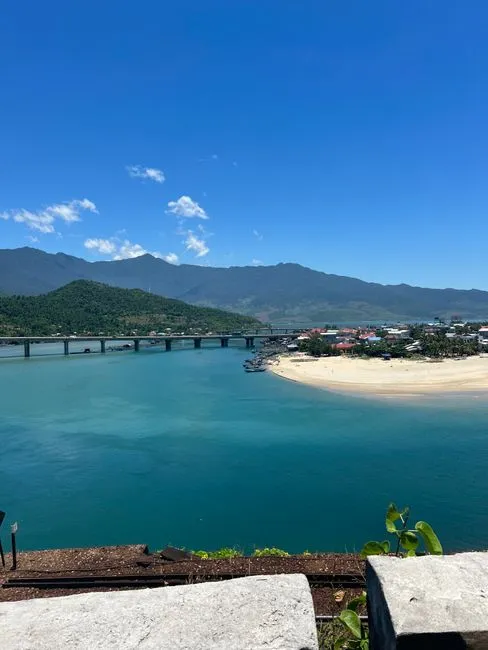 Beautiful view of Da Nang's coast, capturing the bridge, mountains, and blue waters of Lang Co Beach.