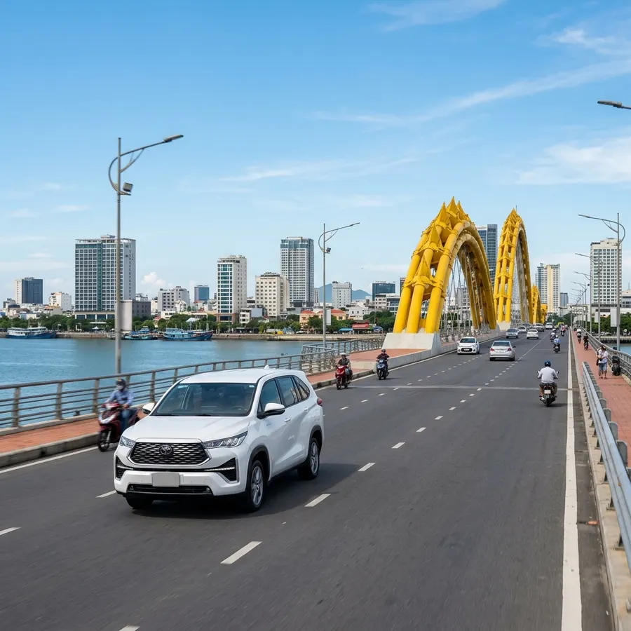 7-seater Toyota Innova driving on Dragon Bridge in Da Nang